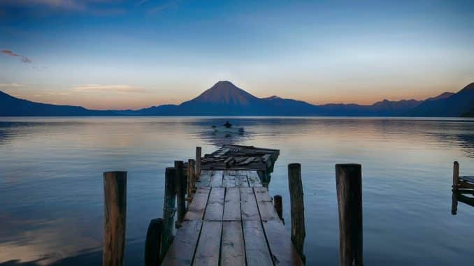 dock near water with cone mountain